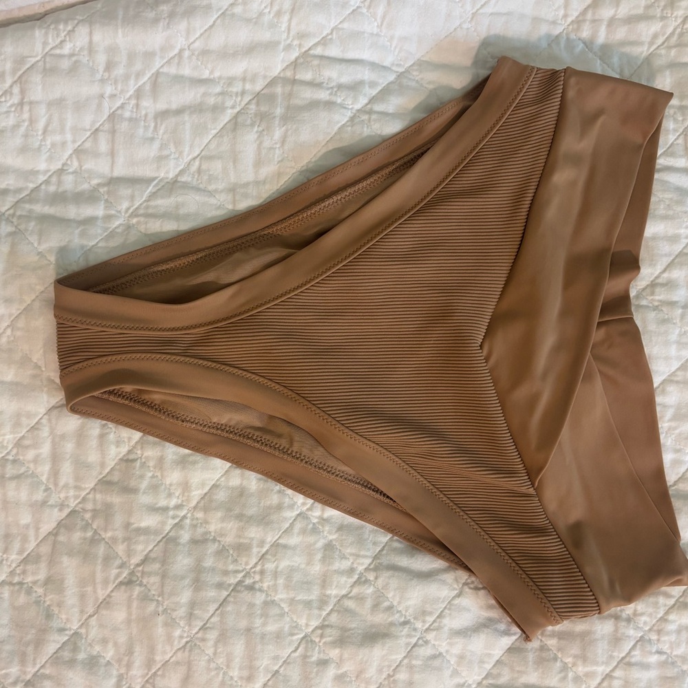 Tan Aerie bathing suit bottoms.